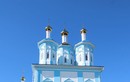 У Казанского храма в Шексне
